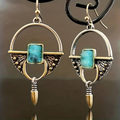 Egyptian earrings featuring a vintage blue stone