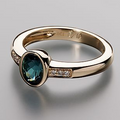 Ring with a blue inlaid gemstone