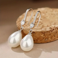 Shiny pearl earrings with lustrous gems