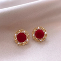 Elegant round earrings crafted from rose gold.