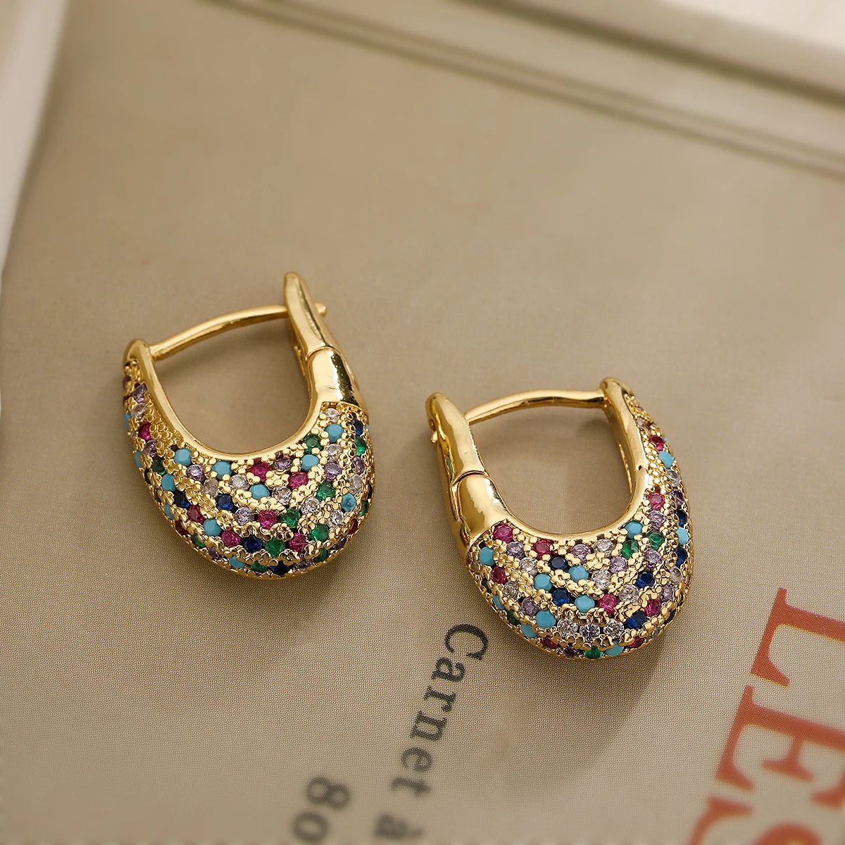 Elegant colorful earrings adorned with inlaid crystals