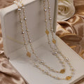 Elegant Pearl and Gold Necklace