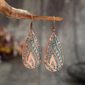 Vintage bronze drop earrings with a dangling design