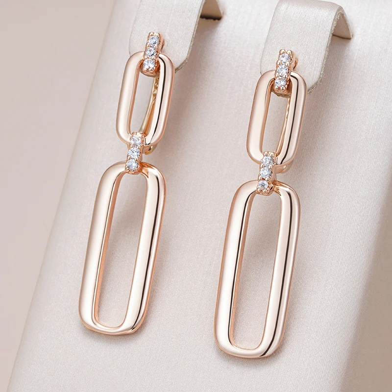 Delicate dangling earrings crafted from gold