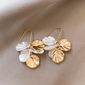 Elegant earrings crafted from white and gold petals