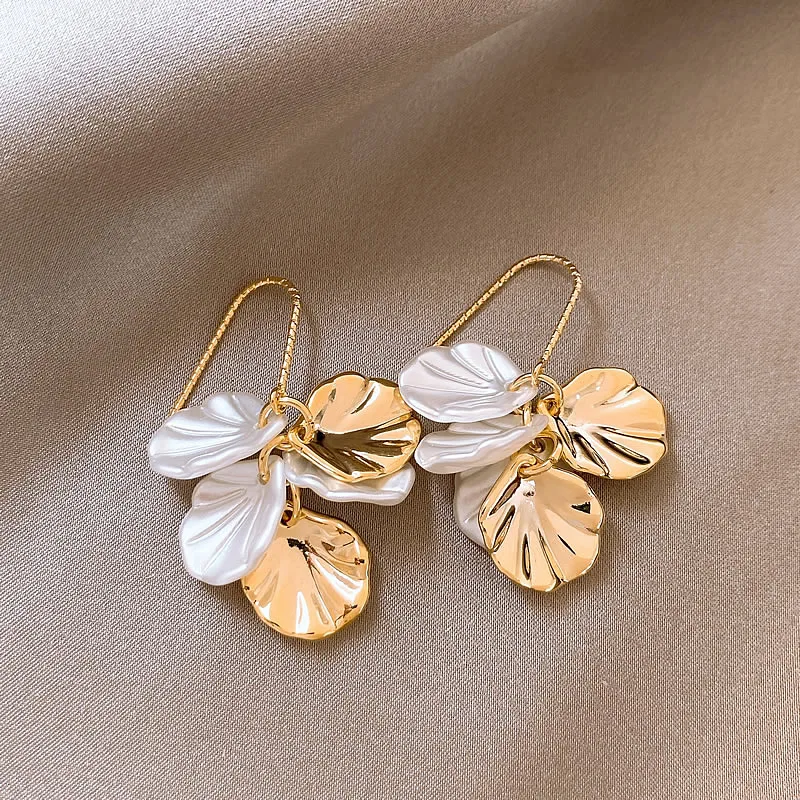 Elegant earrings crafted from white and gold petals