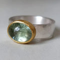 Vintage green ring with a rounded stone