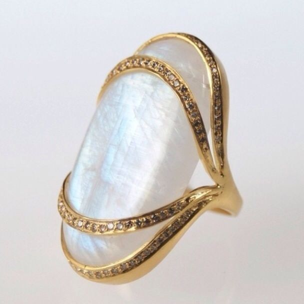 Vintage gold ring with a white stone.
