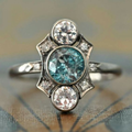 Vintage silver ring with blue and white crystals.