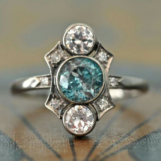 Vintage silver ring with blue and white crystals.