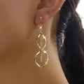 Dangling Swirl Gold Earrings