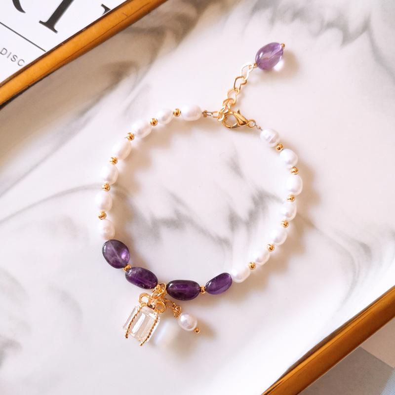 Gold bracelet with purple stones and pearls