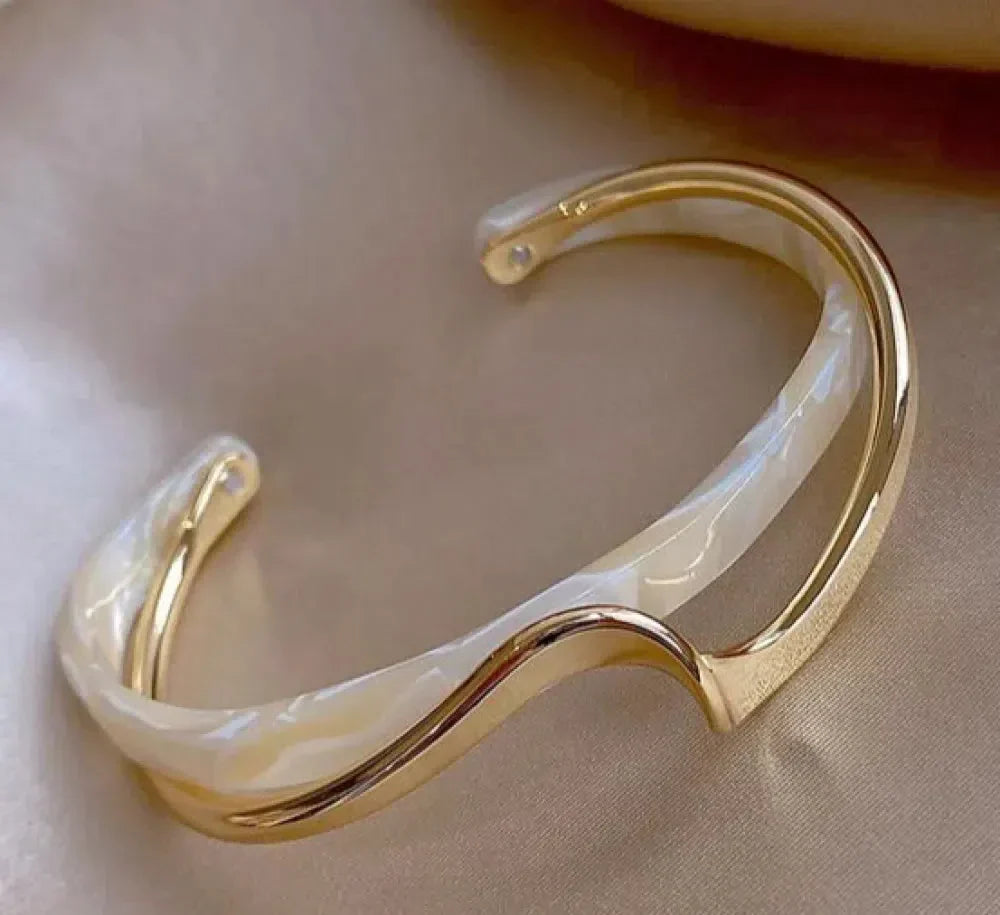 Elegant golden bracelet with white opal accents